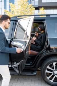 Professional black car service in Washington DC with a sleek vehicle and a well-dressed chauffeur.
