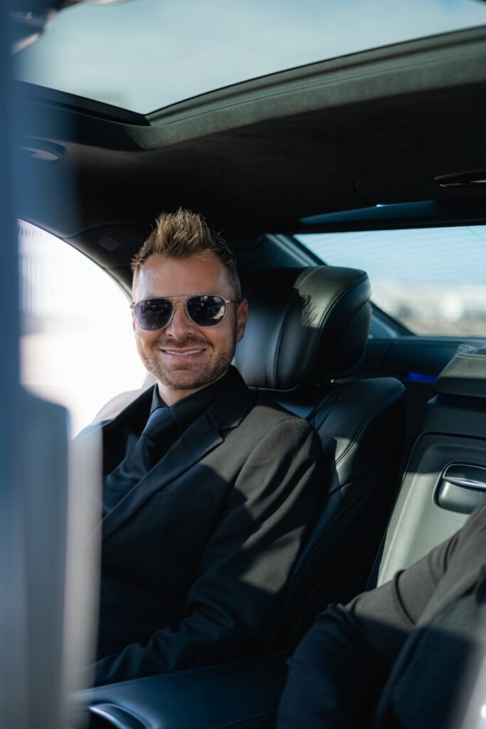 Passenger arriving in style for a night out in a chauffeured car, booked ahead so pickup after the show is just as easy